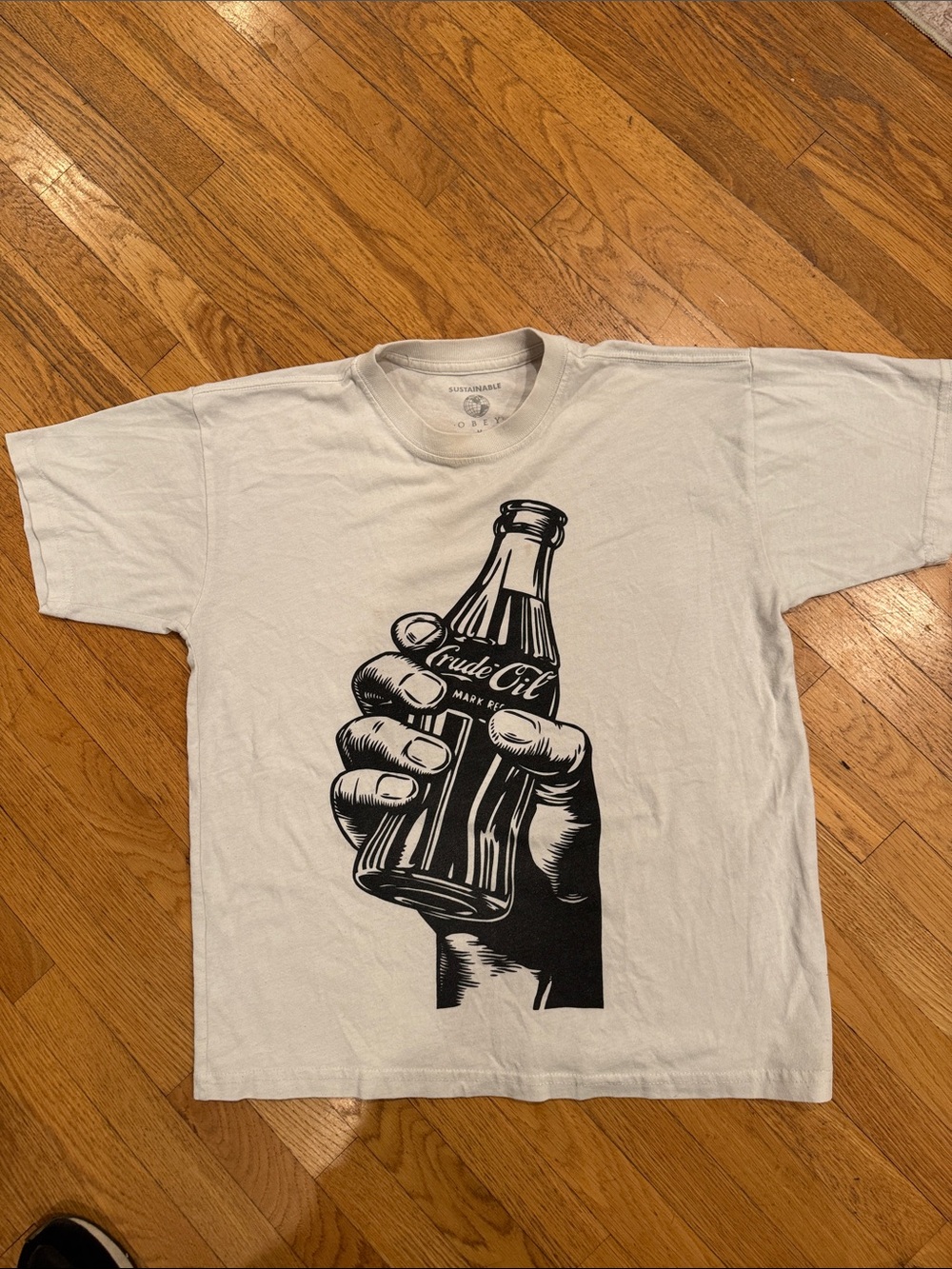 OBEY White Graphic Crewneck T-Shirt with Black Bottle Print- crude oil